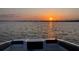 Beautiful lake view from a boat, featuring a stunning sunset on the water at 30215 Island Club Dr, Deer Island, FL 32778