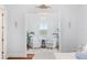 Bright sitting room with matching chairs, plants and luxury decorative accents at 30215 Island Club Dr, Deer Island, FL 32778