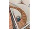 Elegant winding wood staircase with black wrought iron railing and paneled wall creates a grand design at 30215 Island Club Dr, Deer Island, FL 32778