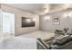 Theater room featuring leather recliners, a large flatscreen tv and carpeted floors at 30215 Island Club Dr, Deer Island, FL 32778