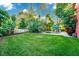 Spacious backyard showcasing a refreshing pool, lounge chairs, and beautifully landscaped greenery at 3518 Edlingham Ct, Belle Isle, FL 32812