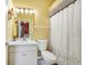 Cozy bathroom features a shower-tub combination and a white single sink vanity at 3518 Edlingham Ct, Belle Isle, FL 32812