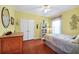 Bright bedroom with wood floors, closet, and window with natural light at 3518 Edlingham Ct, Belle Isle, FL 32812