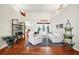 Bright living room with white furniture, hardwood floors, and tall vaulted ceiling at 3518 Edlingham Ct, Belle Isle, FL 32812