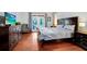 Well-lit main bedroom with hardwood floors, a spacious layout, and access to a private patio for outdoor enjoyment at 3518 Edlingham Ct, Belle Isle, FL 32812