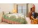 Comfortable bedroom featuring an oversized bed and ample natural light at 3632 Solana Cir # B, Clermont, FL 34711