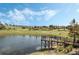 Scenic view of the community dock extending into the lake at 3632 Solana Cir # B, Clermont, FL 34711
