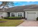 Inviting single-story home featuring a well-maintained lawn and neutral exterior paint at 3632 Solana Cir # B, Clermont, FL 34711