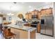 Well-equipped kitchen featuring stainless appliances, granite countertops, and ample storage space at 3632 Solana Cir # B, Clermont, FL 34711