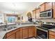 Close-up of a well-appointed kitchen, showcasing granite countertops and stainless steel appliances at 3632 Solana Cir # B, Clermont, FL 34711