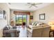 Inviting living room with plenty of natural light and a relaxing outdoor view at 3632 Solana Cir # B, Clermont, FL 34711