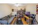 Cozy living room with a ceiling fan and bookshelves, perfect for relaxing and reading at 3632 Solana Cir # B, Clermont, FL 34711