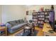Comfortable living room with sofa, area rug, and bookshelf at 3632 Solana Cir # B, Clermont, FL 34711