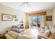 Comfortable living room with sliding glass doors opening to a serene outdoor view at 3632 Solana Cir # B, Clermont, FL 34711