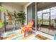 Cozy lanai space decorated with colorful rug, plants, and comfortable seating at 3632 Solana Cir # B, Clermont, FL 34711