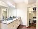 Spacious bathroom featuring a granite-topped vanity and ample storage at 5352 Diplomat Ct # 107, Kissimmee, FL 34746