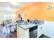 Charming kitchen featuring granite countertops, stainless steel appliances, and adjacent dining area at 5352 Diplomat Ct # 107, Kissimmee, FL 34746