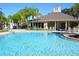 Community pool with comfortable lounge chairs perfect for relaxation at 5352 Diplomat Ct # 107, Kissimmee, FL 34746