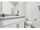 Bathroom with a white vanity, sink, countertop, mirror, toilet, and fixtures at 580 Buchannan Dr, Davenport, FL 33837