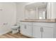 Bathroom featuring double sink vanity, large mirror, and modern fixtures at 580 Buchannan Dr, Davenport, FL 33837
