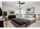 Well-lit bedroom featuring a bed with stylish decor, a ceiling fan, and wood flooring at 580 Buchannan Dr, Davenport, FL 33837