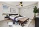 Bright bedroom featuring a plush rug, a comfortable king-size bed, and stylish, modern decor at 580 Buchannan Dr, Davenport, FL 33837