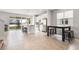 Bright kitchen features stainless appliances, ample counter space, an island with bar seating, and a cozy dining area at 580 Buchannan Dr, Davenport, FL 33837