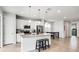 Bright kitchen with stainless appliances, a large island with seating, and an adjacent dining area at 580 Buchannan Dr, Davenport, FL 33837