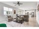 Comfortable living room with neutral tones, ceiling fan, and an open floor plan to the kitchen at 580 Buchannan Dr, Davenport, FL 33837