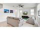 Spacious living room filled with natural light, complemented by a ceiling fan and comfortable furnishings at 580 Buchannan Dr, Davenport, FL 33837