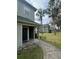 Exterior view of inviting condo with well-manicured landscaping at 6100 Westgate Dr # 203, Orlando, FL 32835