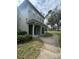 Condo building featuring attached storage, green spaces, and covered walkways at 6100 Westgate Dr # 203, Orlando, FL 32835