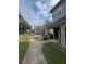Condo community offering lush green spaces and convenient parking areas at 6100 Westgate Dr # 203, Orlando, FL 32835