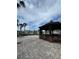 Outdoor gazebo with bar and stools next to the community pool at 6100 Westgate Dr # 203, Orlando, FL 32835