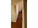 Hallway with wood floors and natural light from windows at 6100 Westgate Dr # 203, Orlando, FL 32835