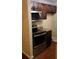 Kitchen featuring dark cabinets, stainless steel appliances, and granite counters at 6100 Westgate Dr # 203, Orlando, FL 32835