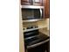 Stainless steel microwave and electric stovetop in this kitchen at 6100 Westgate Dr # 203, Orlando, FL 32835