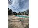 Community pool with a gazebo and plenty of lounge chairs, perfect for relaxation at 6100 Westgate Dr # 203, Orlando, FL 32835