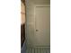 A light-filled porch features a window and a white wall with a door at 6100 Westgate Dr # 203, Orlando, FL 32835