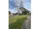 Serene street view with lush landscaping and sidewalks for leisurely strolls at 6100 Westgate Dr # 203, Orlando, FL 32835