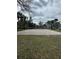 A community sand volleyball court, surrounded by palm trees and green grass, for active recreation at 6100 Westgate Dr # 203, Orlando, FL 32835