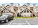 Charming condo building featuring architectural details such as arched windows and reserved parking at 625 Greencove Ter # 130, Altamonte Springs, FL 32714