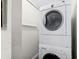 Laundry room with stacked washer and dryer at 625 Greencove Ter # 130, Altamonte Springs, FL 32714