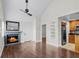 Spacious living room with a ceiling fan, a fireplace, and access to the kitchen and other rooms at 625 Greencove Ter # 130, Altamonte Springs, FL 32714