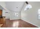 Bright living room featuring vaulted ceilings, a large window, and laminate floors at 625 Greencove Ter # 130, Altamonte Springs, FL 32714