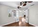 Bright living room featuring wood floors, fireplace, and large windows with lots of natural light at 625 Greencove Ter # 130, Altamonte Springs, FL 32714