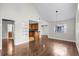 Inviting open layout with laminate flooring, bar seating, and a view of the cozy living area at 625 Greencove Ter # 130, Altamonte Springs, FL 32714