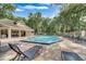 Community swimming pool and clubhouse with comfortable lounge chairs at 625 Greencove Ter # 130, Altamonte Springs, FL 32714