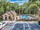 Overhead view of community swimming pool and clubhouse with ample parking at 625 Greencove Ter # 130, Altamonte Springs, FL 32714
