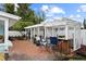 Spacious backyard featuring a pergola with seating, a built-in bar, and a well-maintained brick patio at 625 Worthington Dr, Winter Park, FL 32789